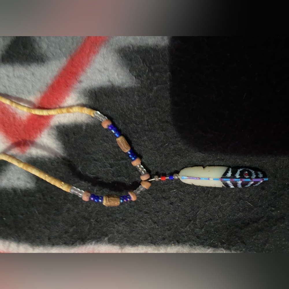 Handcrafted Beaded Necklace with Feather Pendant